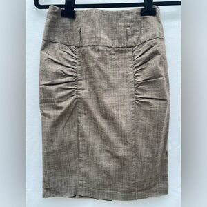 High-waisted, body-hugging pencil skirt